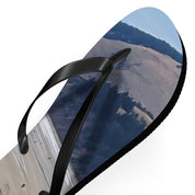 Flip-flops with a landscape image of hills and trees on the sole.
