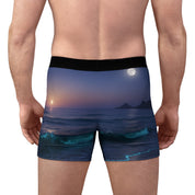 Man wearing boxer briefs with a moonlit ocean and waves scene.