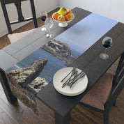 Table runner with rocky coastline and ocean scene.