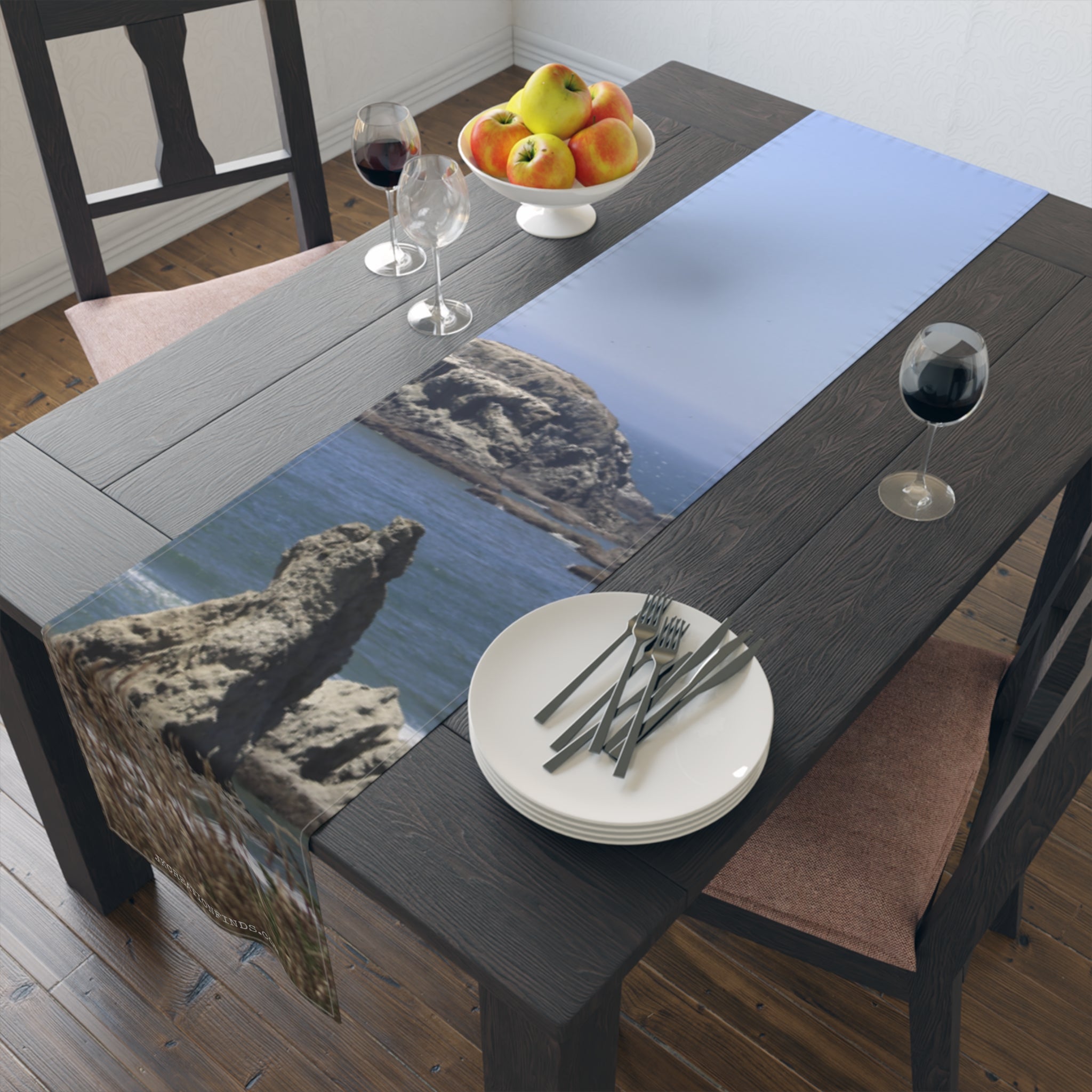 Table runner with rocky coastline and ocean scene.