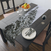Table runner with snow-covered evergreen tree branches.