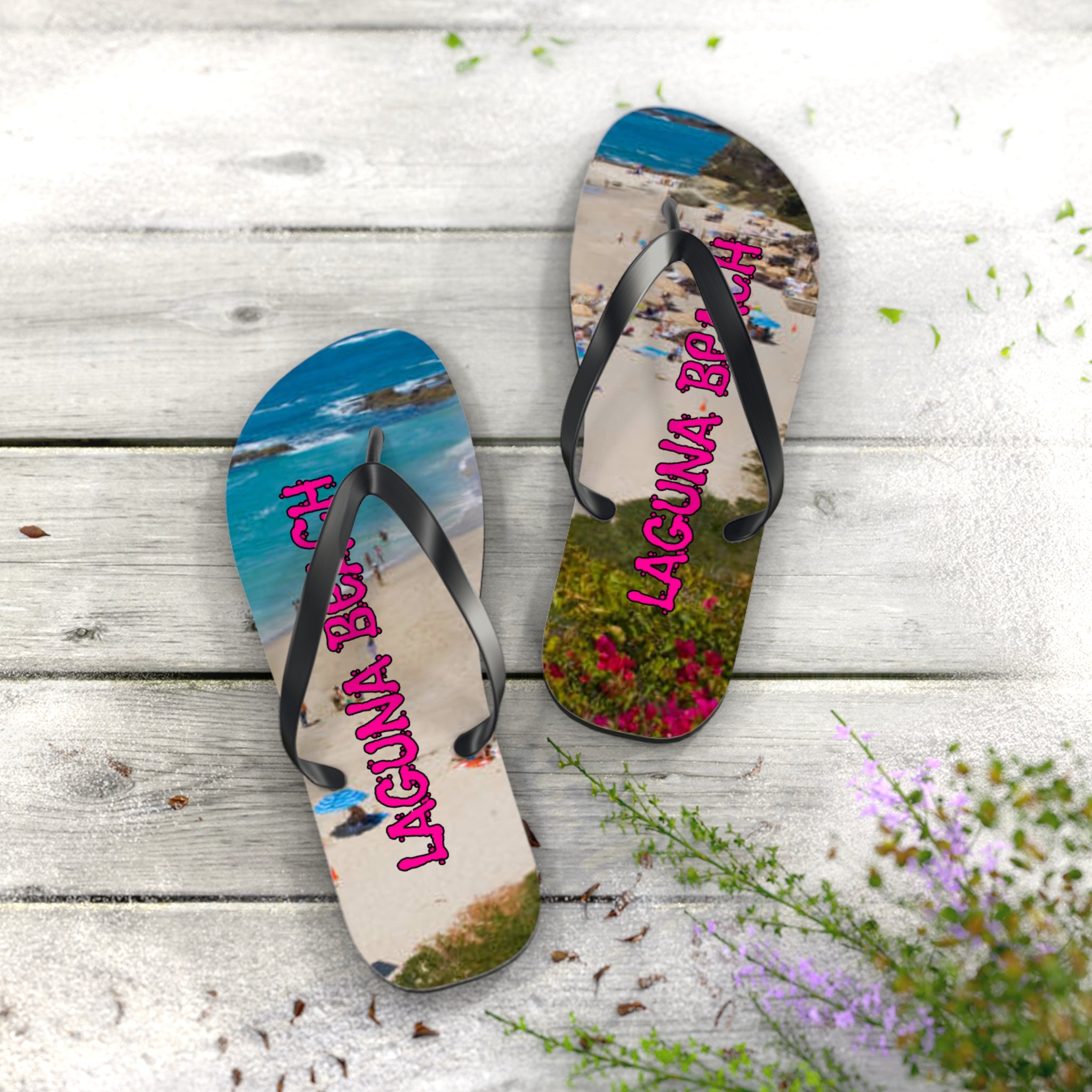 Laguna Beach flip-flops with floral accents on a wooden deck.