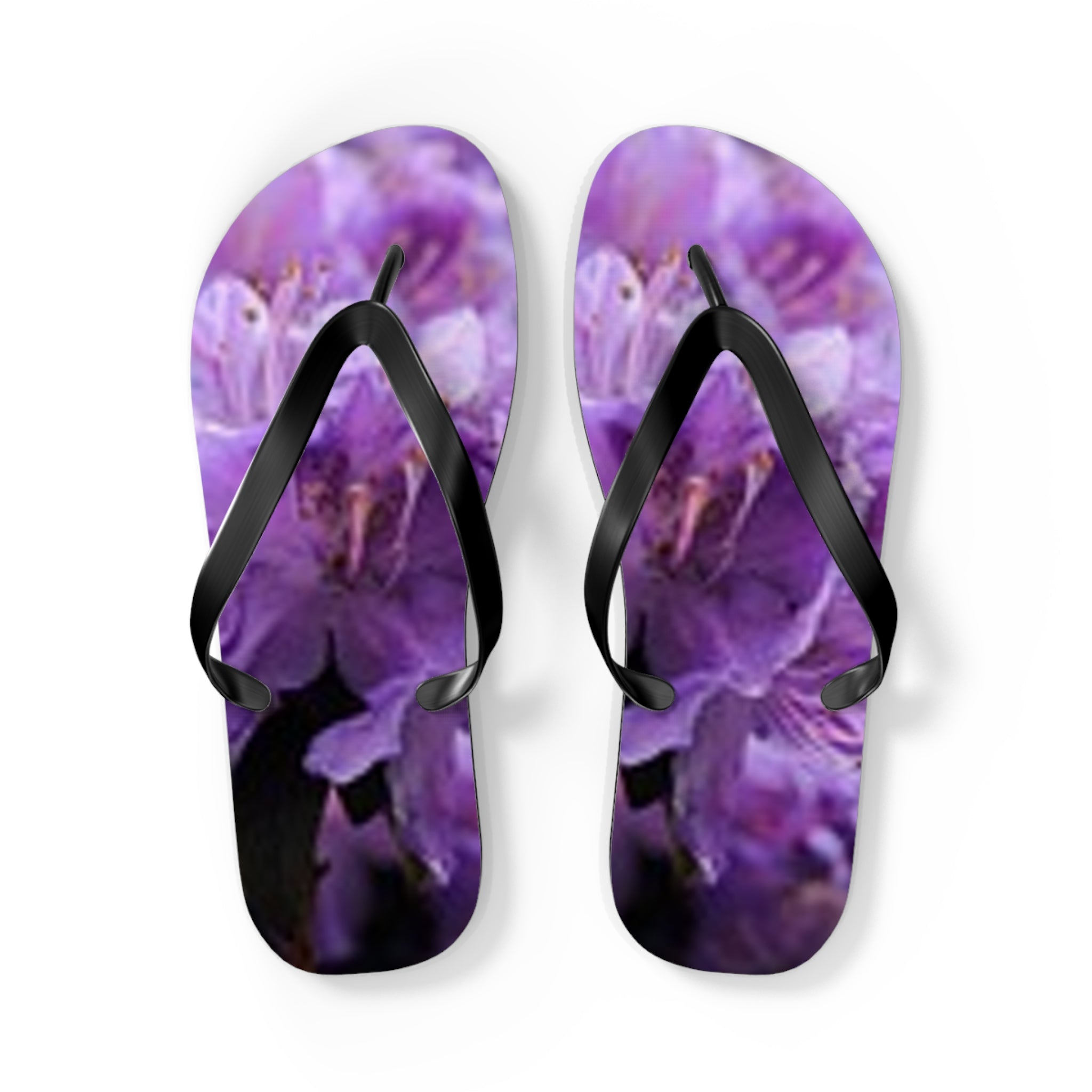 Purple floral flip-flops with black straps.