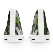 High-top sneakers with a floral print against a dark background.