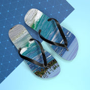 Flip-flops with a beach and ocean wave scene on the soles.