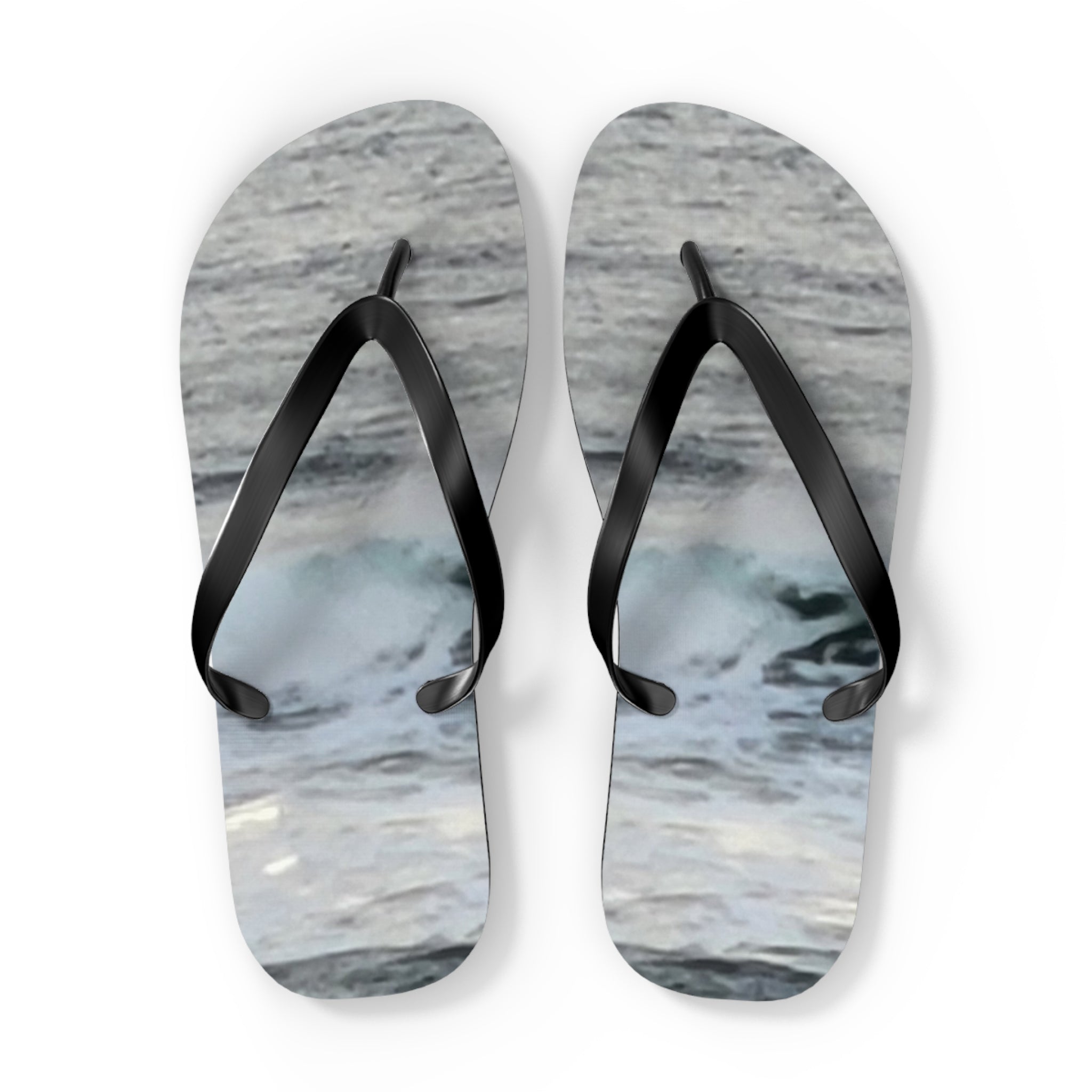 Flip-flops with a wave pattern on a white background.