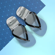 Light blue flip-flops with a textured white footbed and black straps.