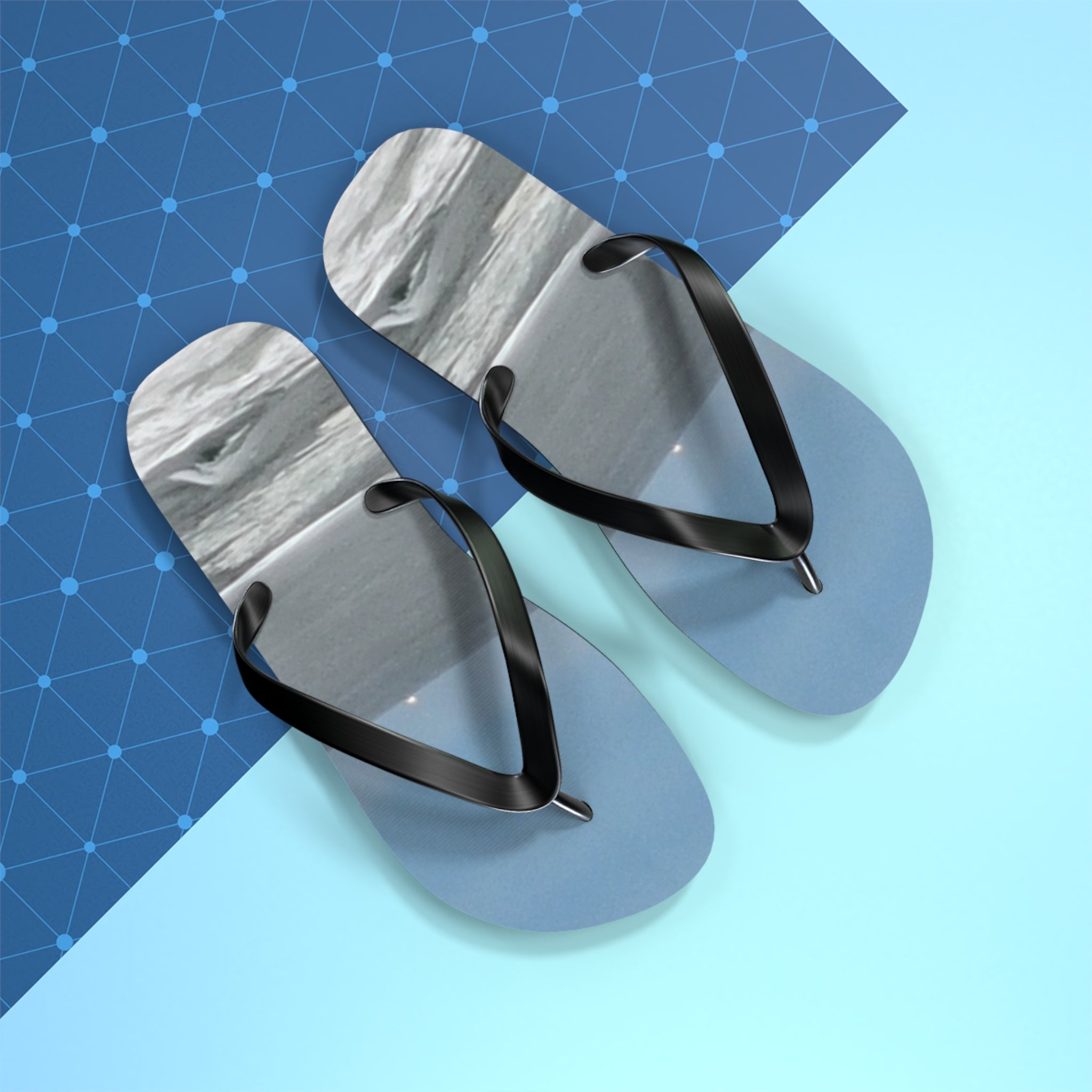 Light blue flip-flops with a textured white footbed and black straps.
