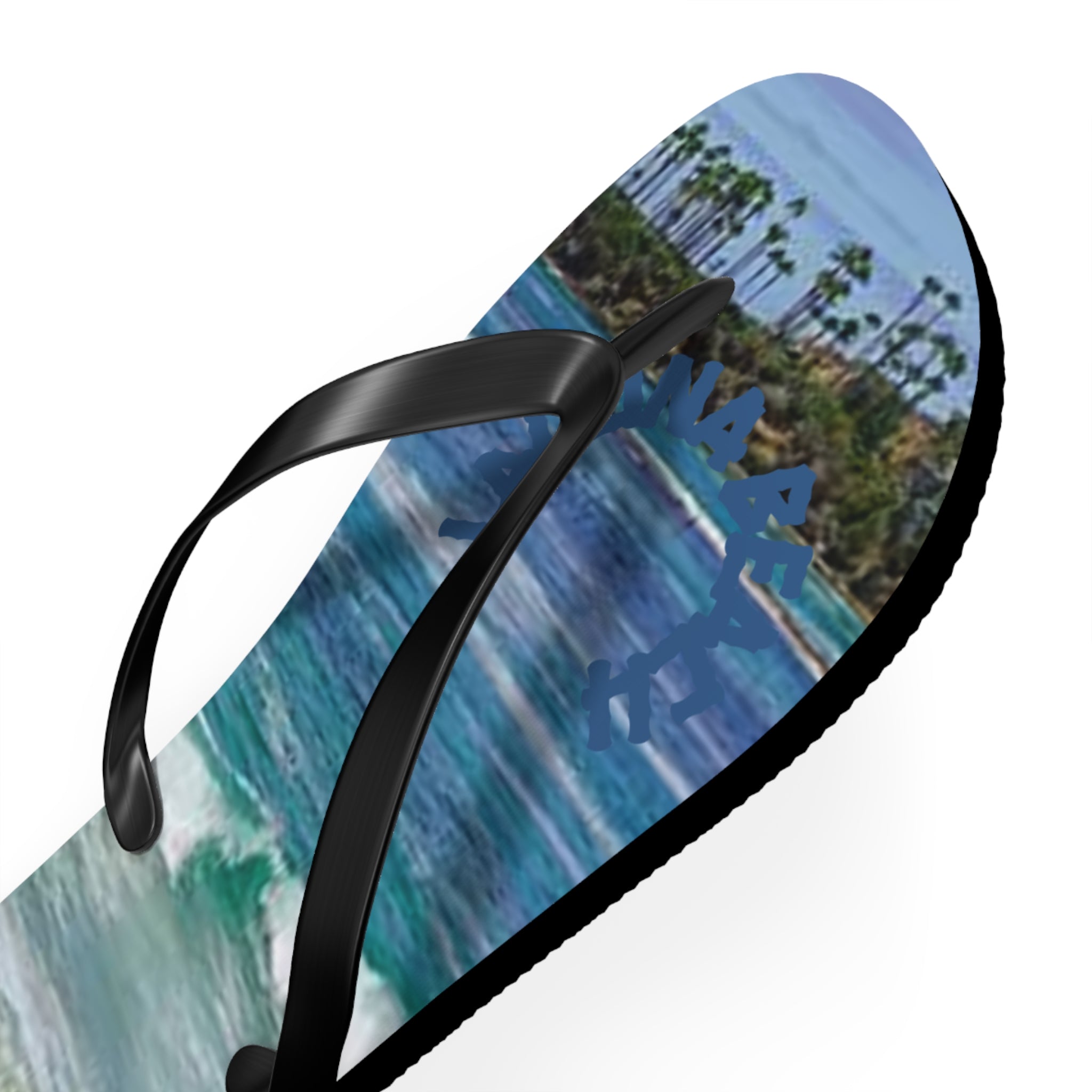 Flip-flops with palm trees and ocean waves graphic.