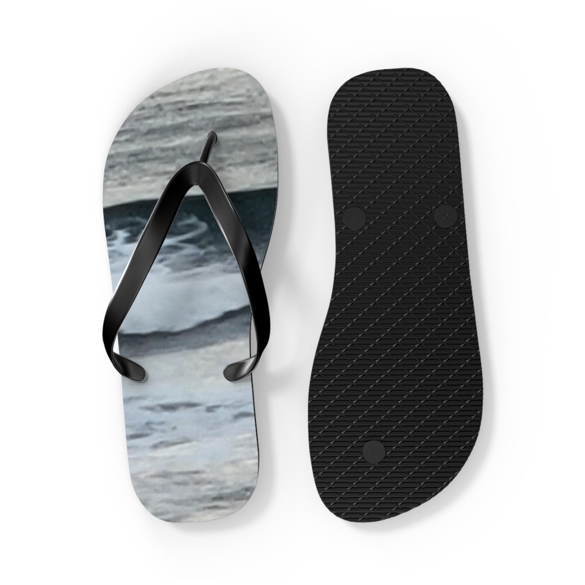 Flip-flops with a wave pattern and textured black sole.