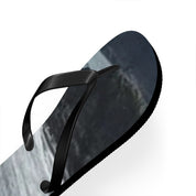 Black flip-flop with a grey, rocky landscape pattern on the sole.