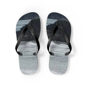 Black flip-flops with a black and white landscape print.