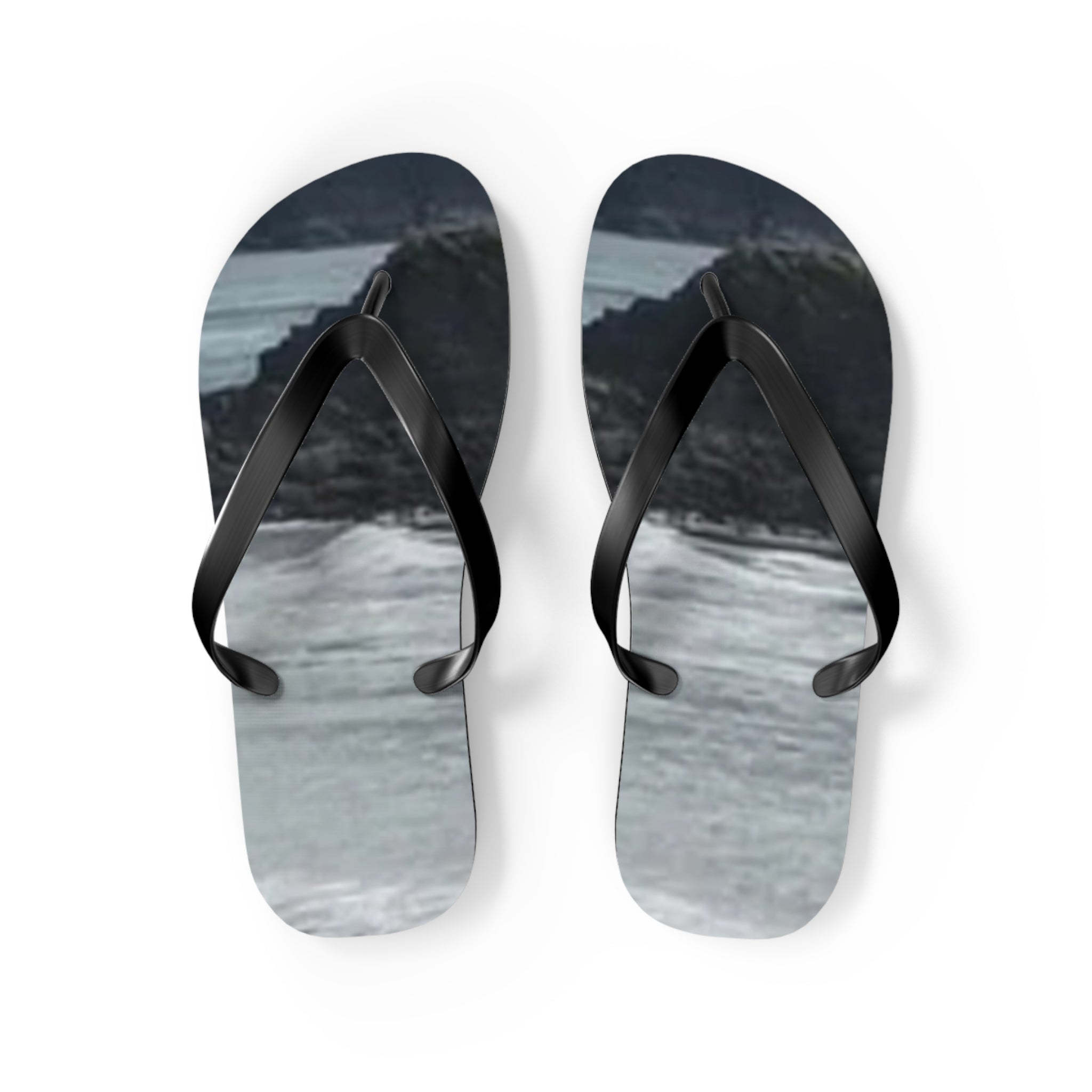 Black flip-flops with a black and white landscape print.
