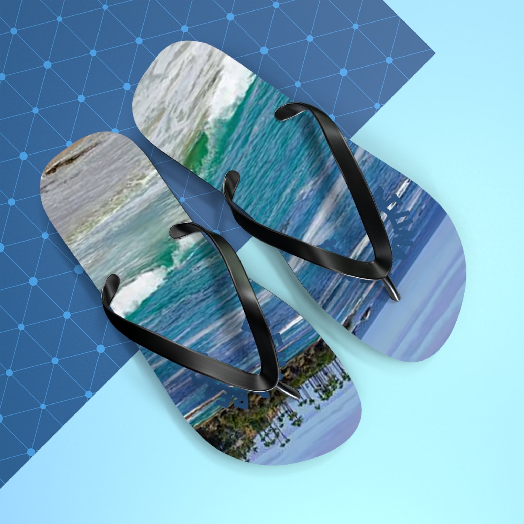 Flip-flops with a tropical beach wave scene and palm trees.