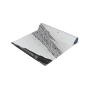 Rolled yoga mat with a black and white abstract texture and the URL "RECREATIONFINDS.COM".