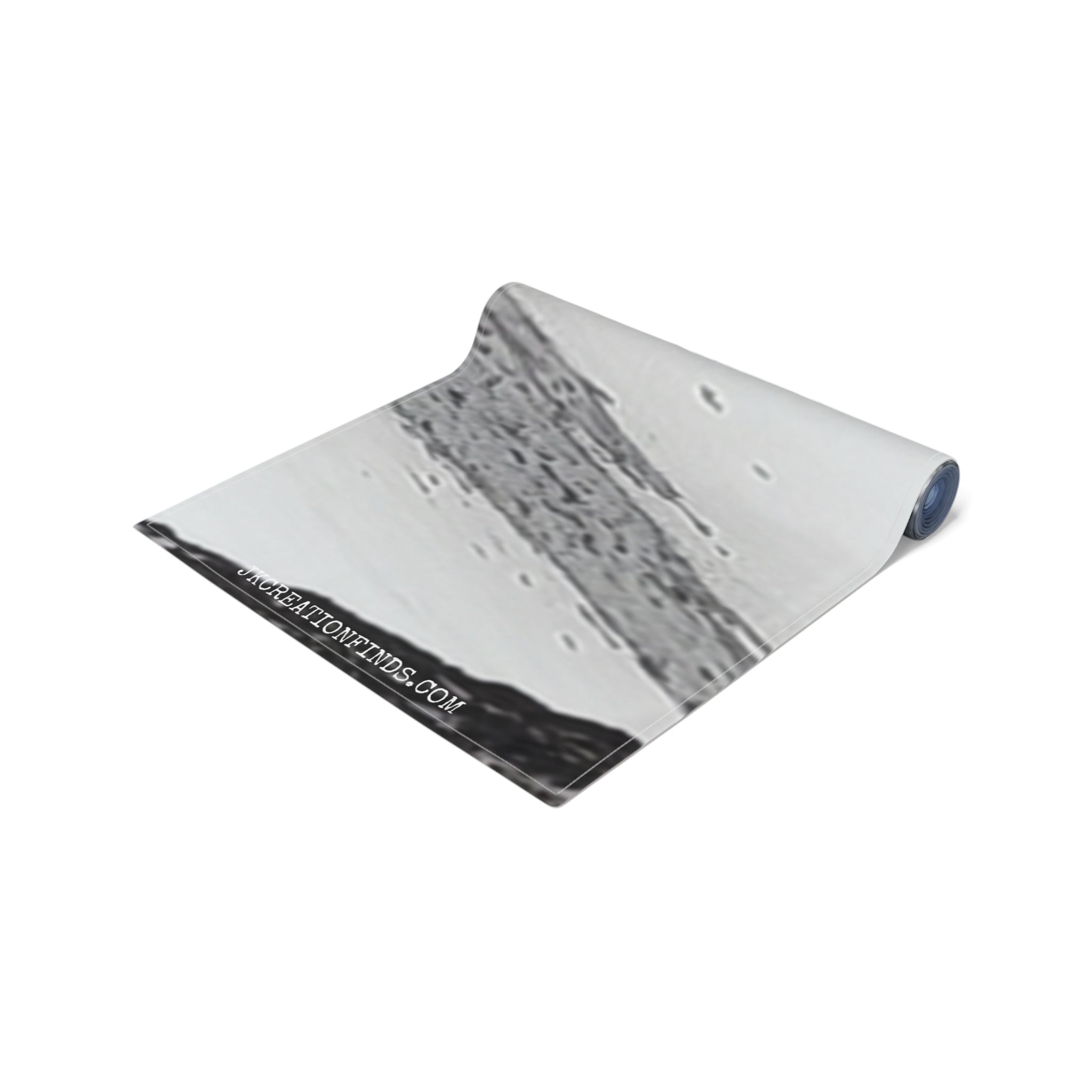 Rolled yoga mat with a black and white abstract texture and the URL "RECREATIONFINDS.COM".