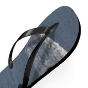 Black flip-flop with a grey textured sole on a white background.
