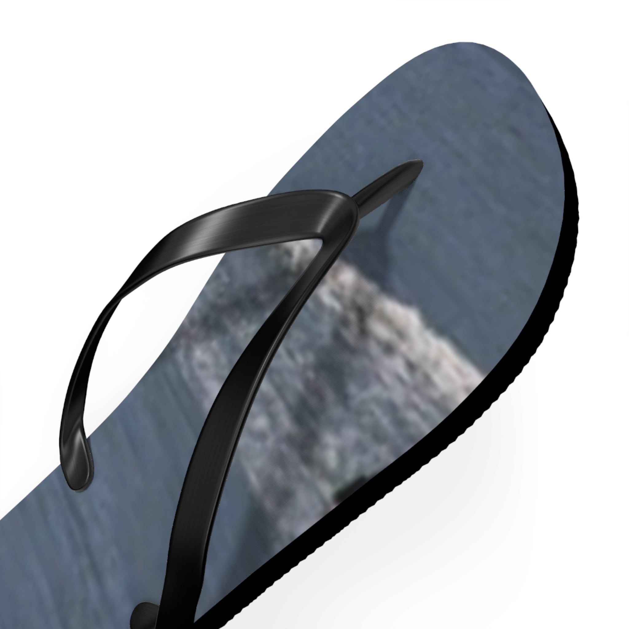 Black flip-flop with a grey textured sole on a white background.