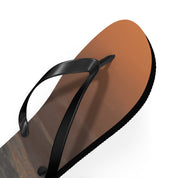 Black flip-flop with a gradient sunset design on the sole.