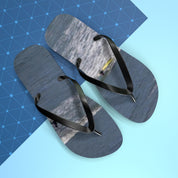 Flip-flops with a surfer on a wave on a blue and light blue background.