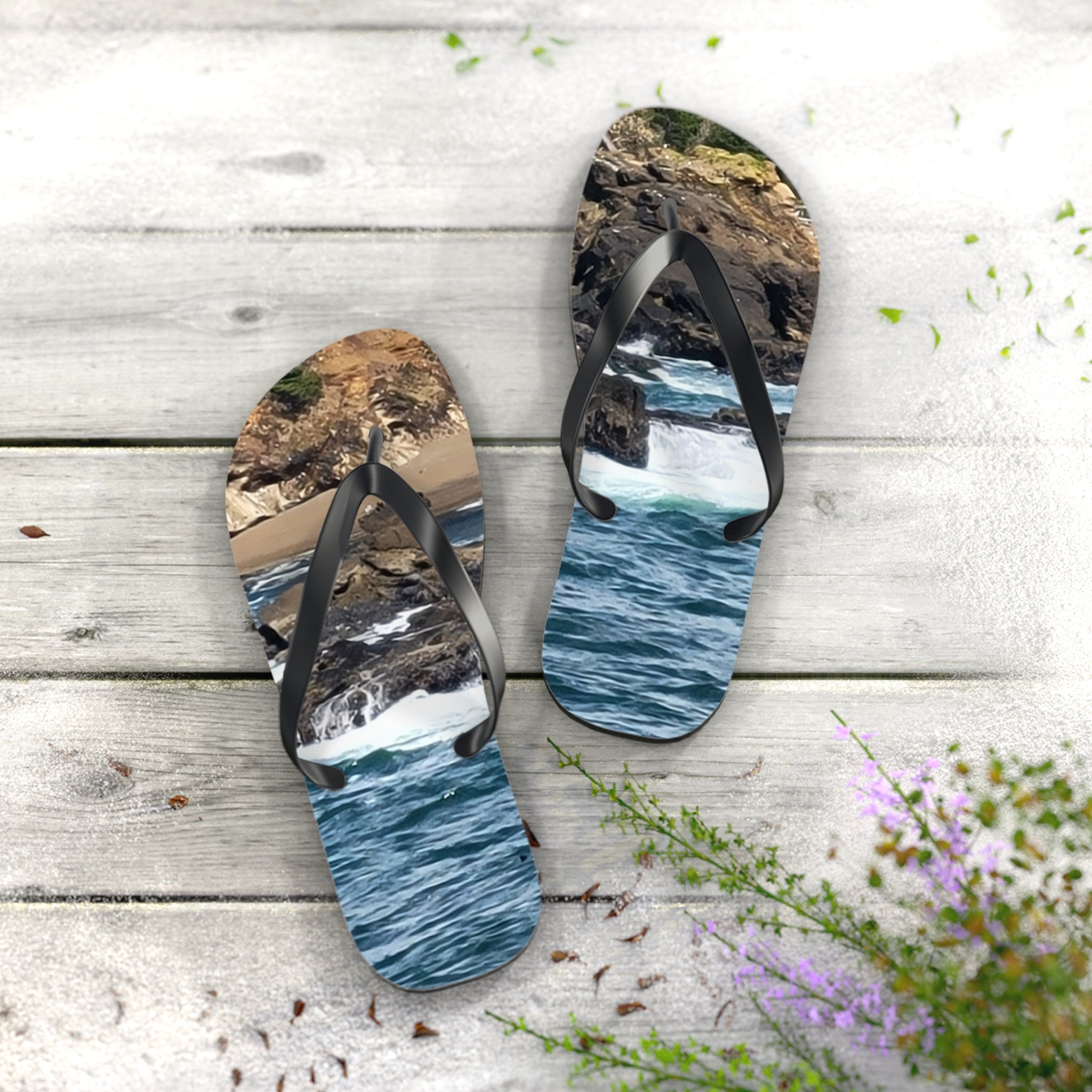 Flip-flops with a beach and ocean scene printed on them.