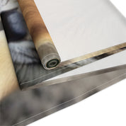 Close-up of a rolled-up tapestry featuring a cat's face.