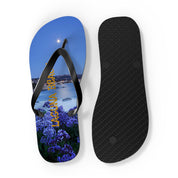 Flip-flops with Laguna Beach graphic and a moonlit ocean view.