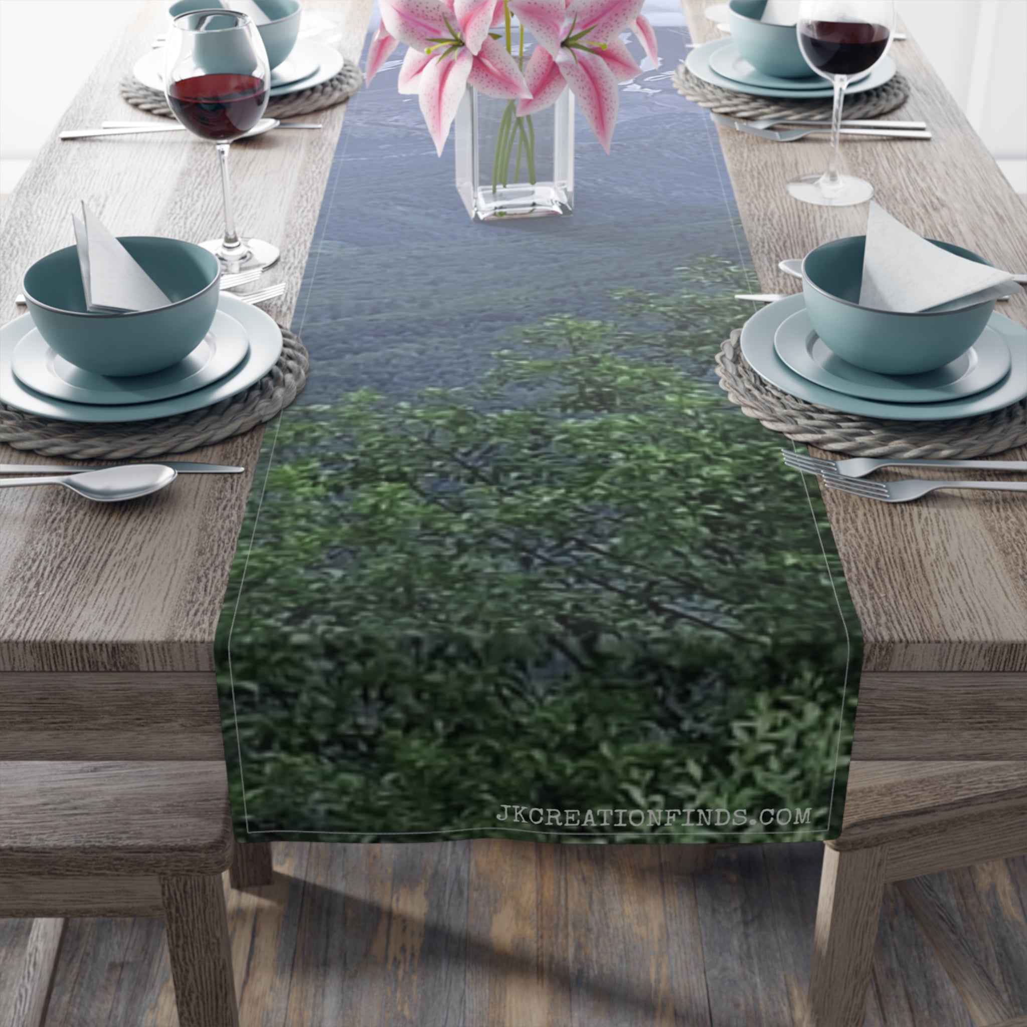 Table runner with a blurred forest and mountain scene.