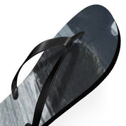 Black flip-flop with a grey, white, and black abstract mountainous design.