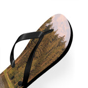 Flip-flops with a forest and sky print on a white background.