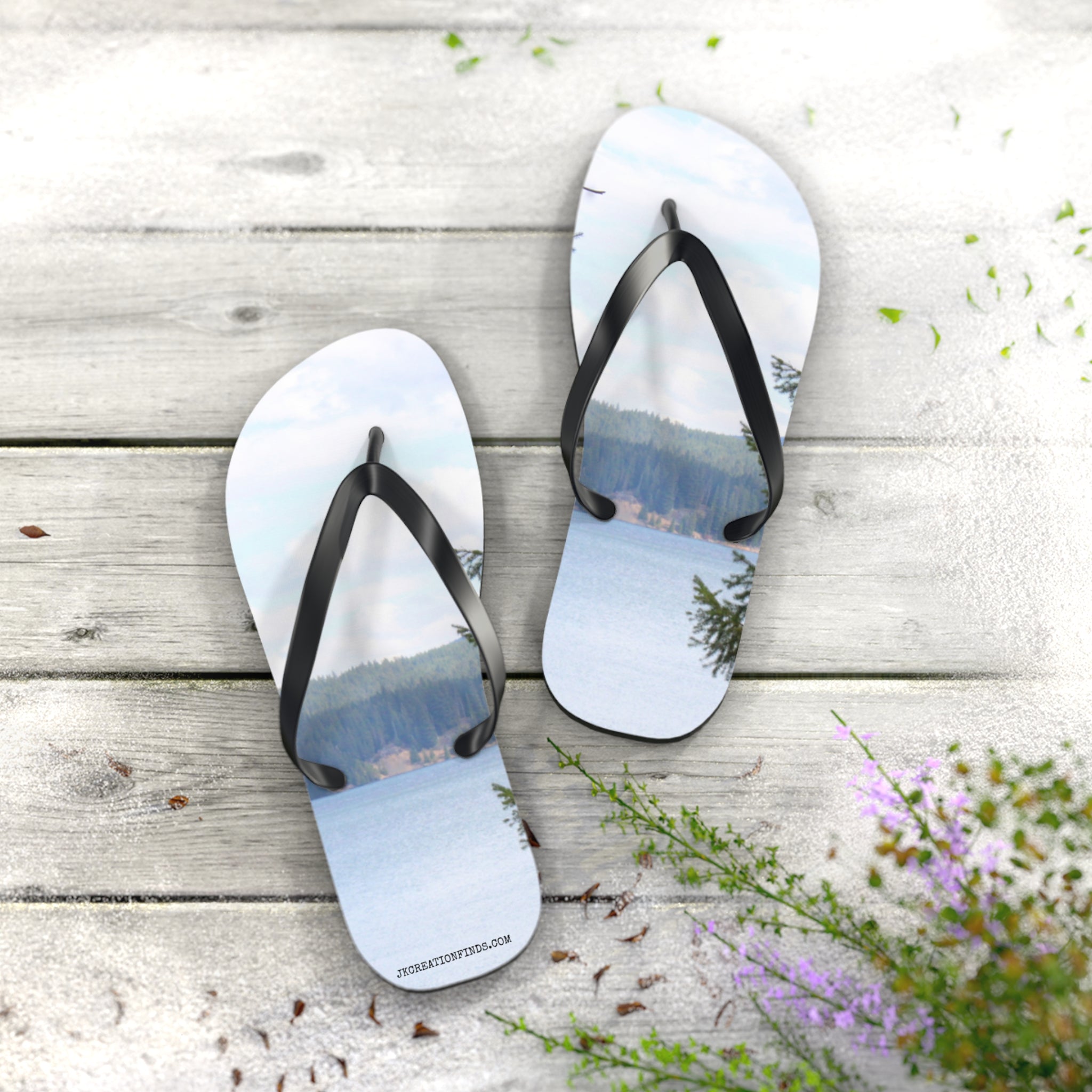 Flip-flops with a scenic lake and forest view printed on them.