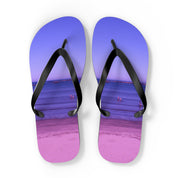 Purple flip-flops with a beach scene printed on the soles.