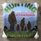 Bigfoot family against Mount St. Helens, Washington landscape.