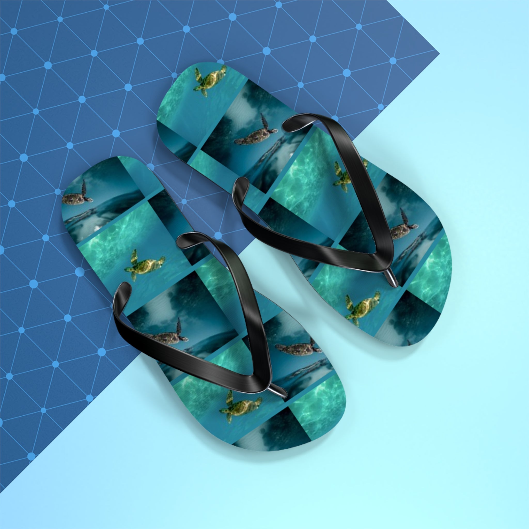 Flip-flops with repeating sea turtle underwater pattern on blue geometric background.