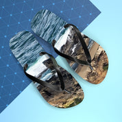 Flip-flops with a coastal landscape design on blue and gray background.