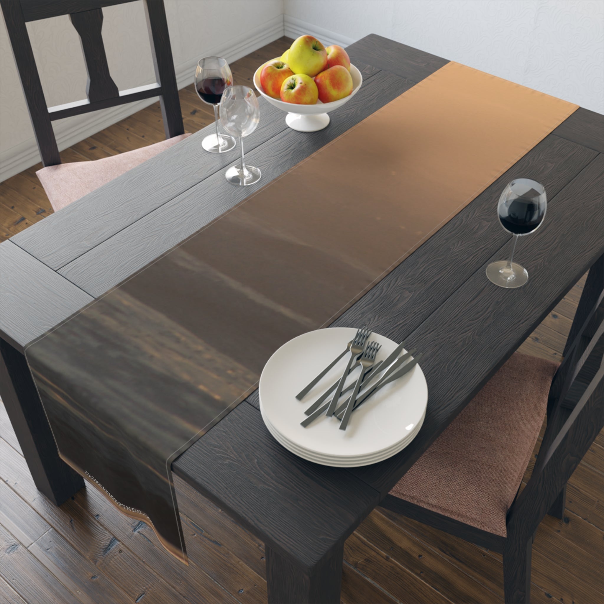 Dark wood dining table set with fruit bowl, plates, and wine glasses.