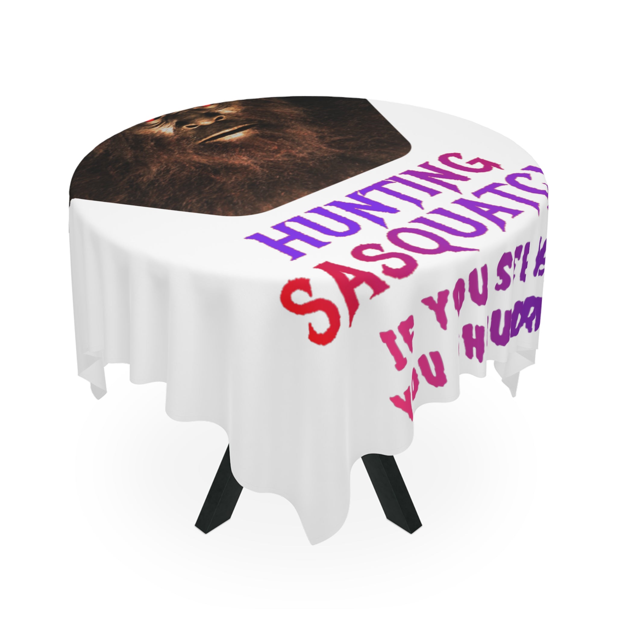 Round tablecloth with "Hunting Sasquatch" text and Bigfoot's face.