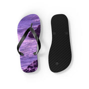 Purple ocean wave flip-flop and black sole on white background.
