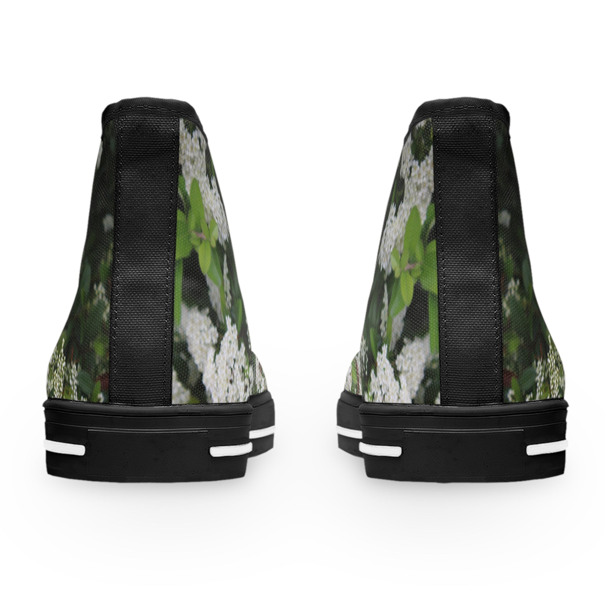 Black high-top sneakers with white floral pattern on a white background.