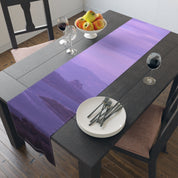 Purple mountain landscape table runner on a dark wood dining table.