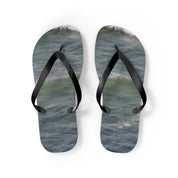 Flip-flops with a blue wave pattern on white background.