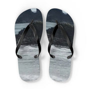 Pair of flip-flops with a scenic mountain and water landscape print.