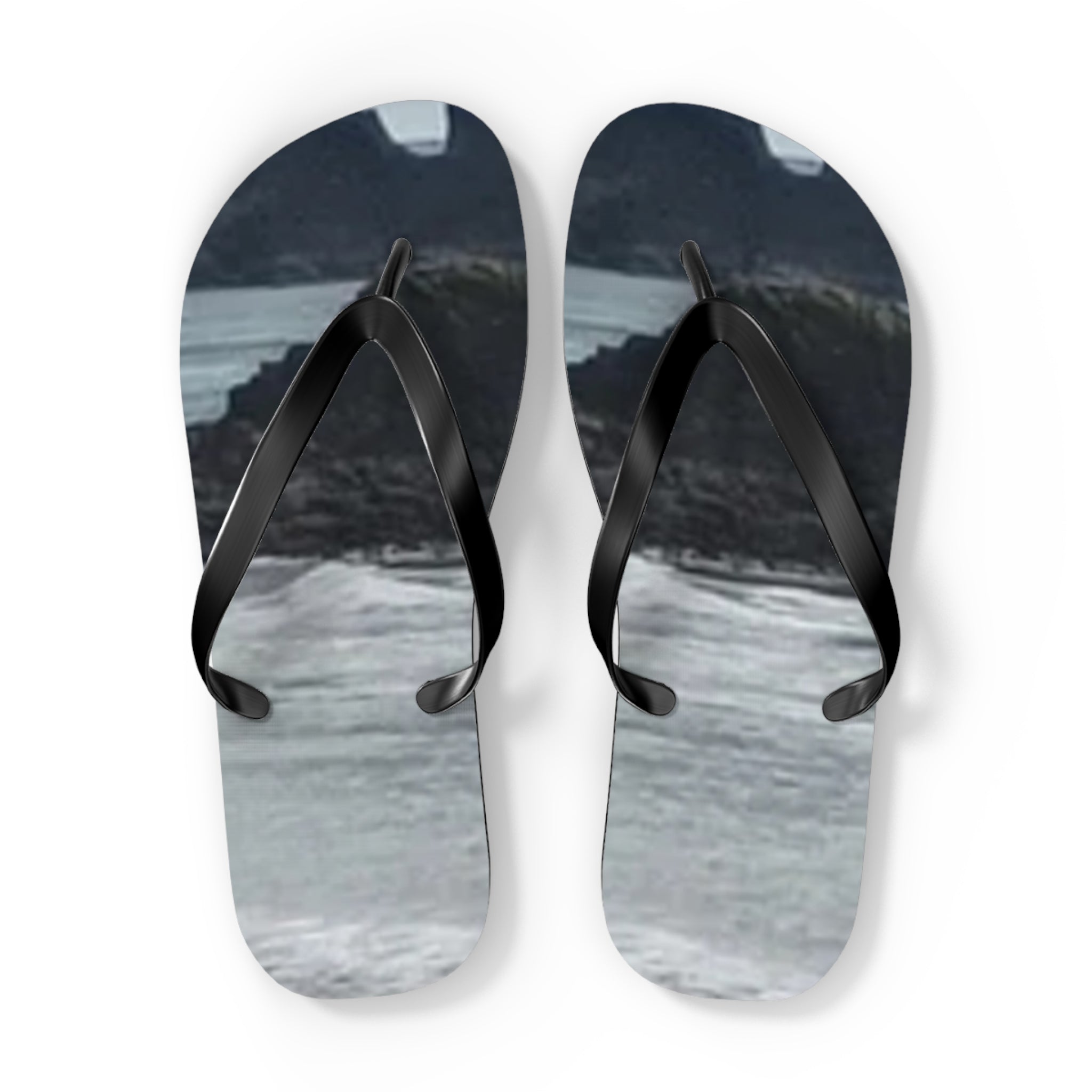 Pair of flip-flops with a scenic mountain and water landscape print.