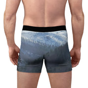 Boxer briefs with a winter forest and snow-covered mountains print.