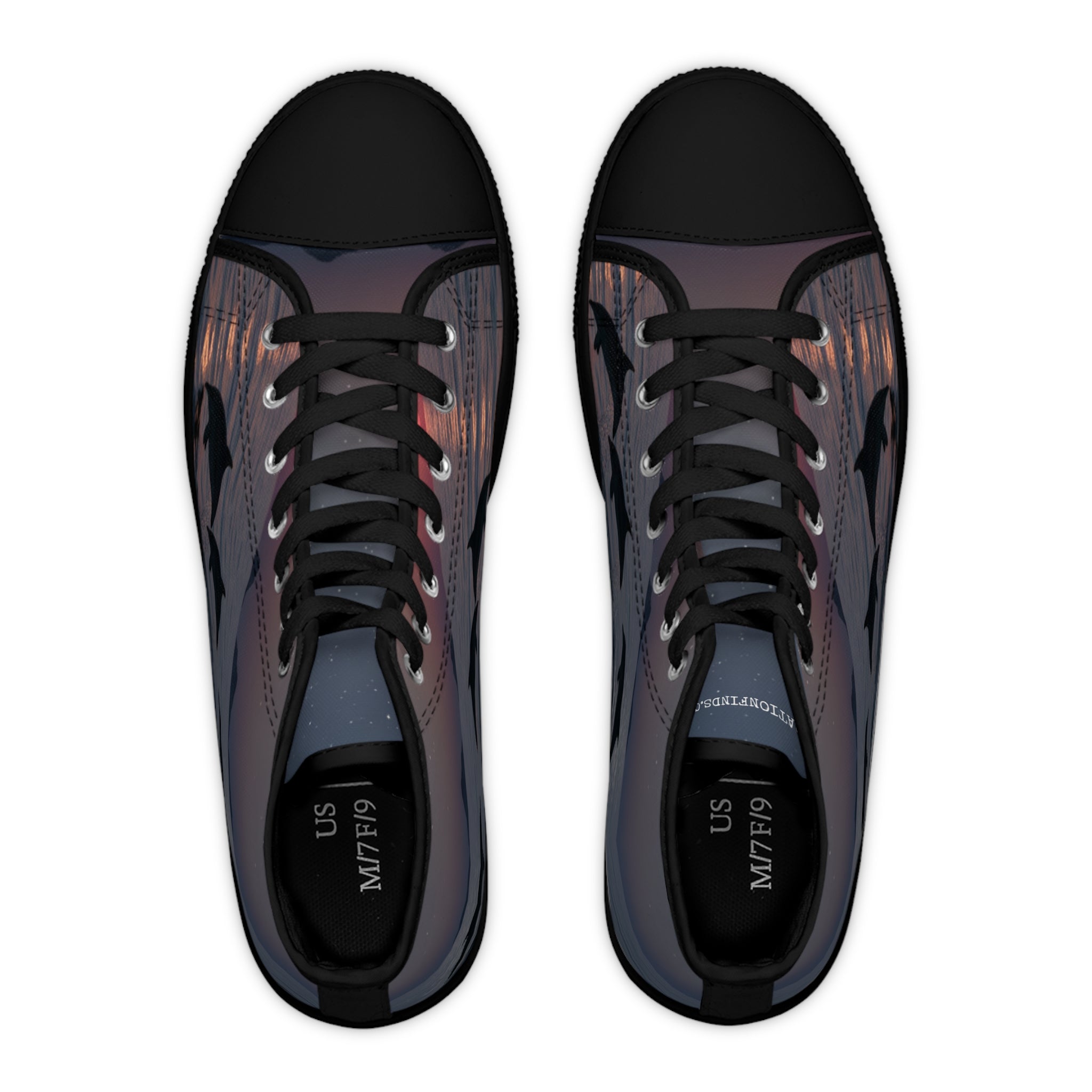 High-top sneakers with leaping dolphin silhouette pattern against sunset.