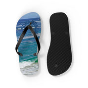 Black flip-flops with a wave graphic on one sole, shown on a white background.