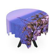 Tablecloth with a seascape and green leaves design.