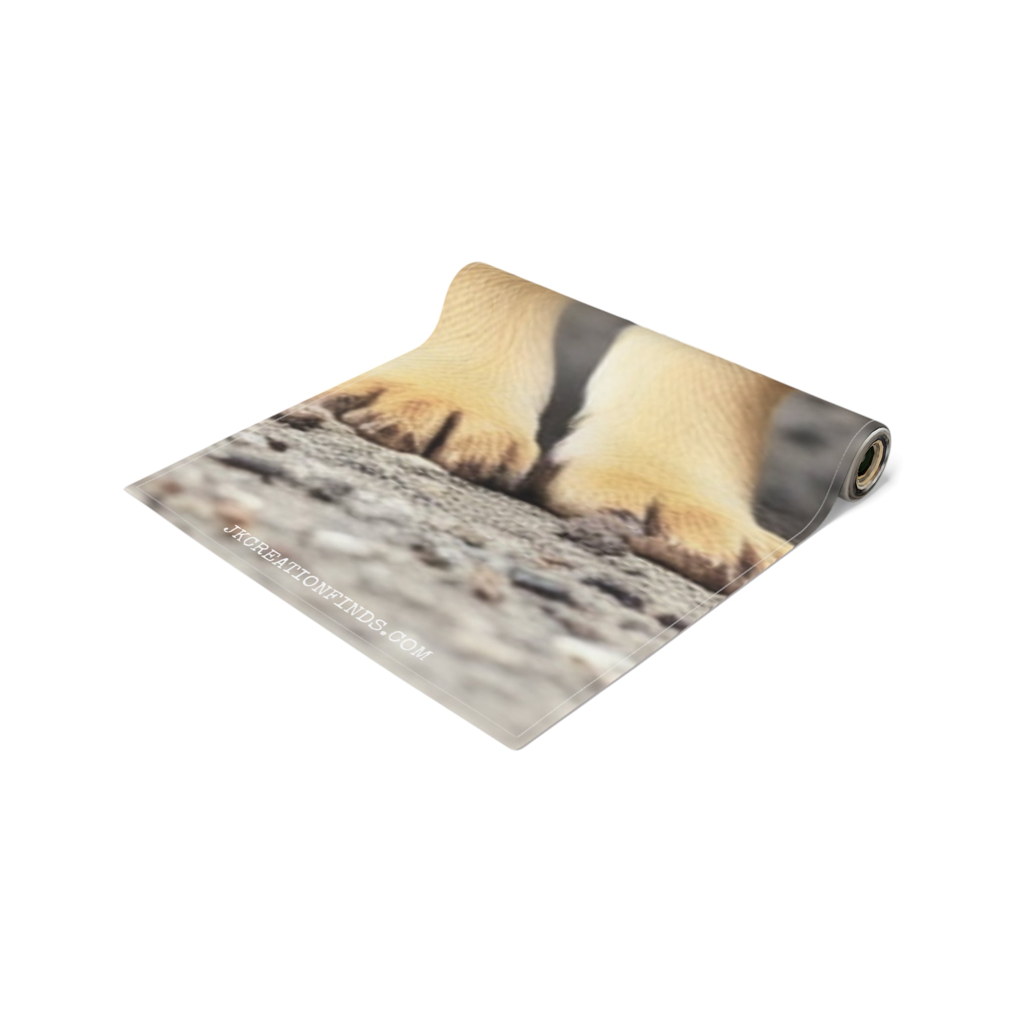 Close up of puppy paws on a textured surface, with a website URL visible.