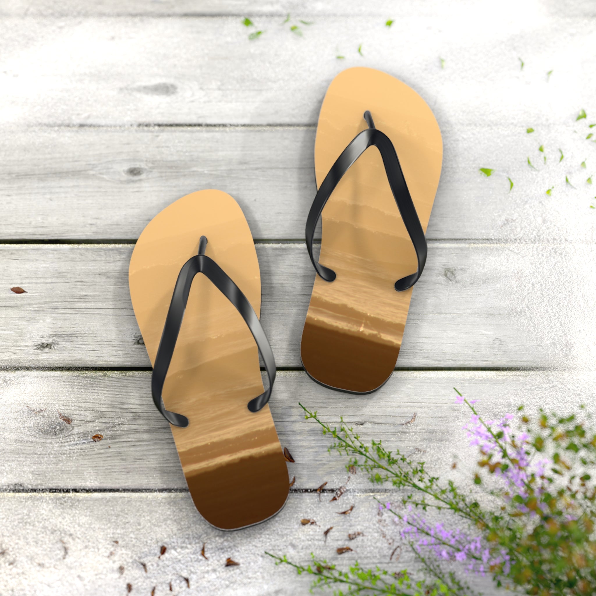 Flip-flops with beach scene inlay on weathered wooden planks.