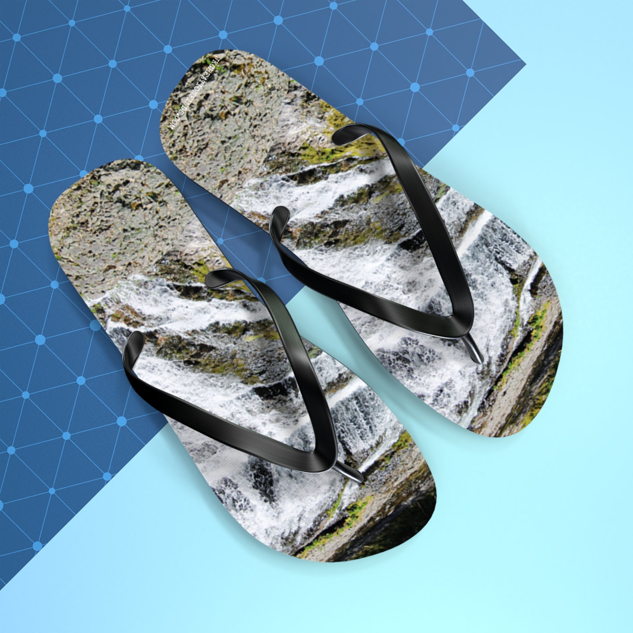 Flip-flops with a waterfall pattern on a blue and light blue background.